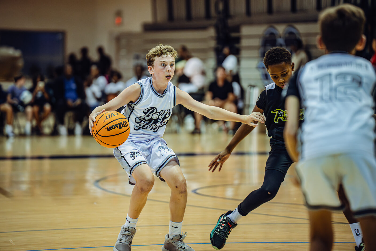Born 2 Hoop player attacking against defensive pressure