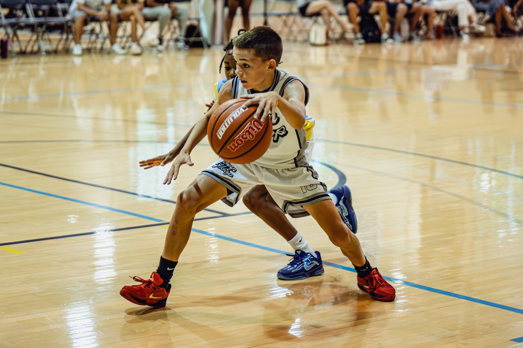 Born 2 Hoop player protecting the ball against defensive pressure